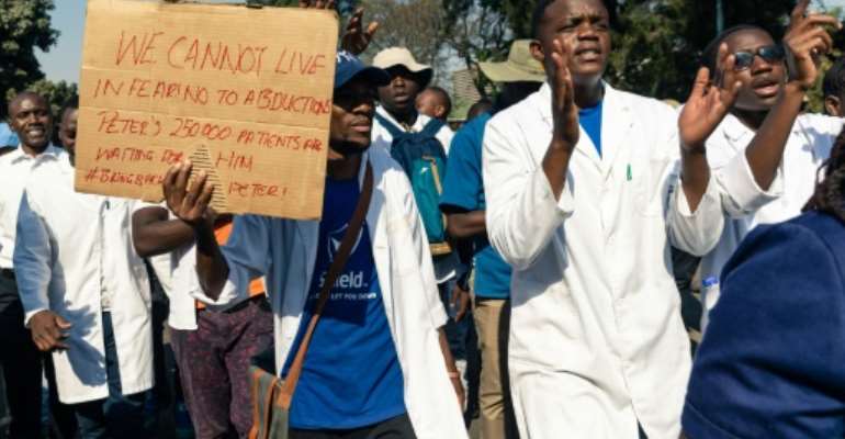 Doctors and medical staff have marched in Harare to protest over Magombeyi's disappearance. By Jekesai NJIKIZANA (AFP)