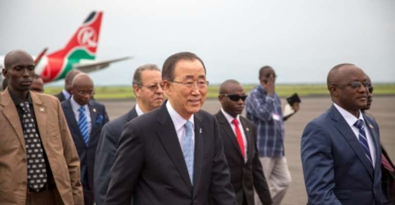 United Nations Secretary-General Ban Ki-Moon (C) walks with Burundi's Vice President Gaston Sindimwo at Bujumbura airport on February 22, 2016. By Griff Tapper (AFP)