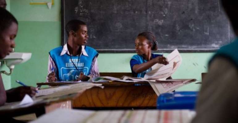 Election officials count ballots at the Njanja polling station in Lubumbashi. By Phil Moore (AFP/File)