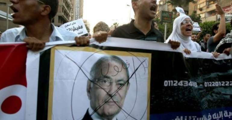 Egyptian protesters shout slogans against presidential candidate Ahmed Shafiq. By Marwan Naamani (AFP)