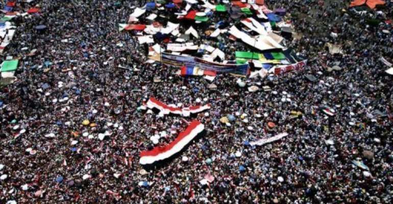 Supporters of the Muslim Brotherhood's presidential candidate pack Cairo's landmark Tahrir Square Friday. By Marwan Naamani (AFP)