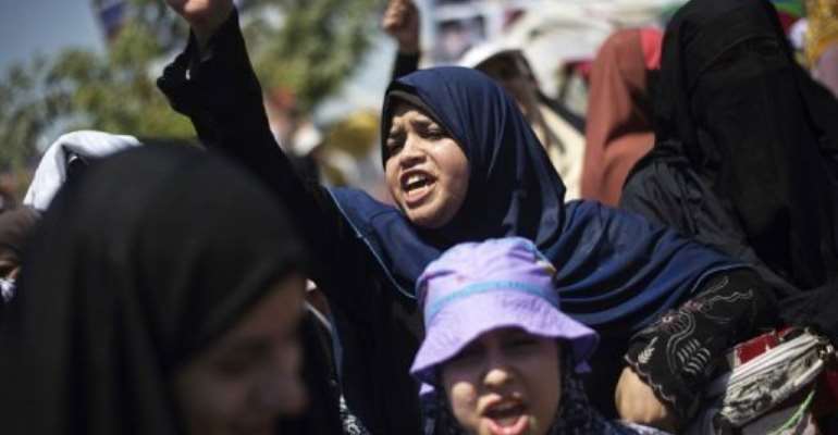Supporters of Mohammed Morsi take part in a sit-in outside Cairo's Rabaa al-Adawiya mosque on August 7, 2013. By Gianluigi Guercia (AFP)