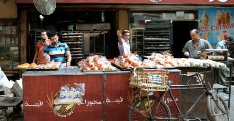 Egyptian bakers prepare croissants at a bakery in a popular Cairo street on August 26, 2013. By Marwan Naamani (AFP/File)