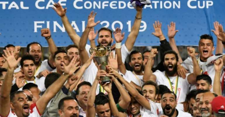 Egyptian club Zamalek celebrate winning the 2019 CAF Confederation Cup. They will not defend the title having qualified for the richer CAF Champions League. By Khaled DESOUKI (AFP)