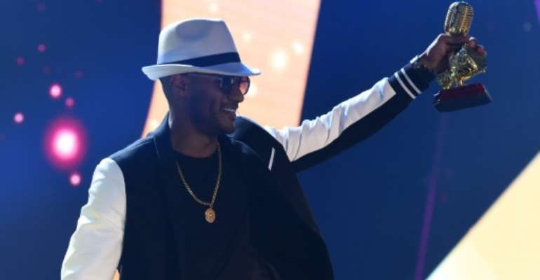 Egyptian singer Mohamed Ramadan receives the African Fan's Favourite Award award during the 2019 All Africa Music Awards (AFRIMA) in Lagos, on November 24, 2019. By PIUS UTOMI EKPEI (AFP/File)