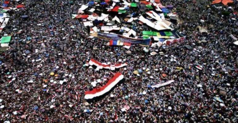Supporters of the Muslim Brotherhood's presidential candidate pack Cairo's landmark Tahrir Square Friday. By Marwan Naamani (AFP)
