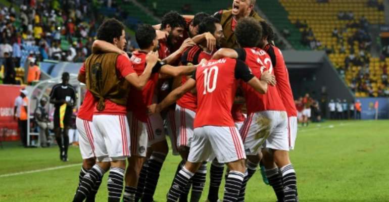 Egypt's players celebrate a goal on January 21, 2017. By Justin TALLIS (AFP)