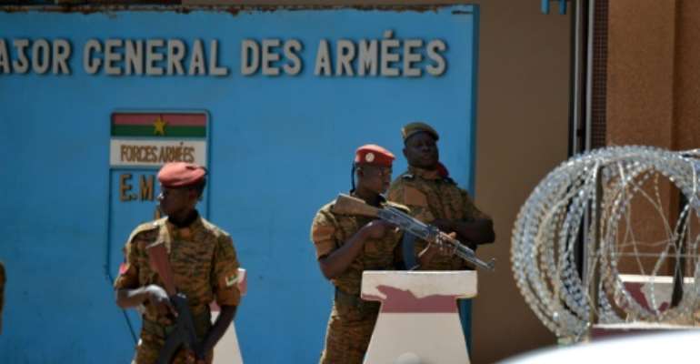 Eight soldiers died in twin attacks on the Burkinabe army headquarters and the French embassy in March. By Ahmed OUOBA (AFP/File)