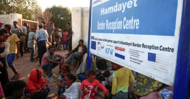Ethiopian migrants who fled intense fighting in the Tigray region gather in the border reception centre of Hamdiyet in Sudan's eastern Kassala State on November 14, 2020. By Ebrahim HAMID (AFP)