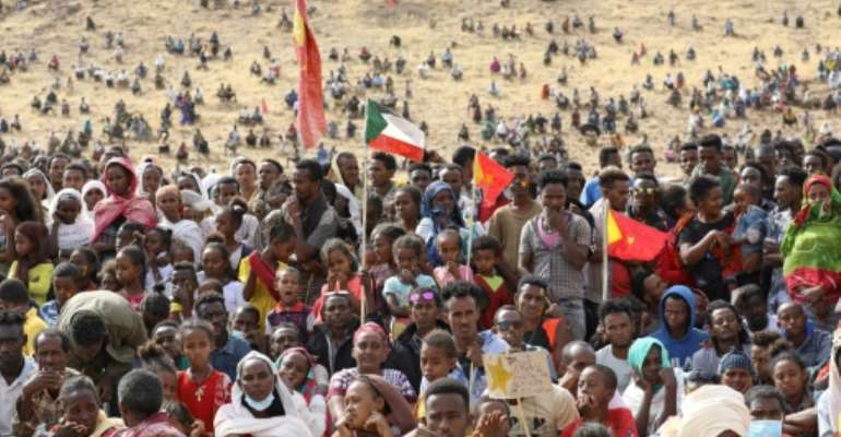 Ethiopian refugees gather to celebrate the 46th anniversary of the Tigray People's Liberation Front at Um Raquba refugee camp in Gedaref, eastern Sudan, on February 19, 2021. By Hussein Ery (AFP)