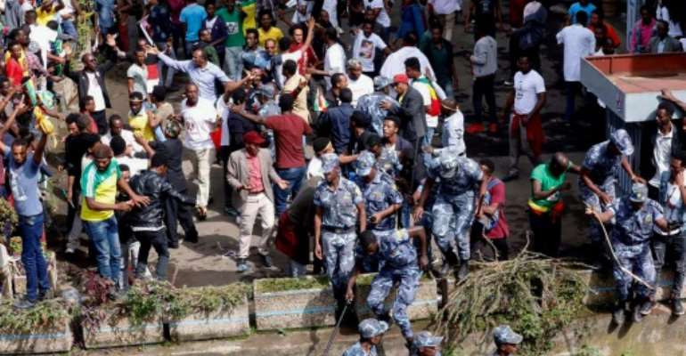 Ethiopian security forces intervene after a blast killed several people during a rally called by Prime Minister Abiy Ahmed. By YONAS TADESE (AFP)