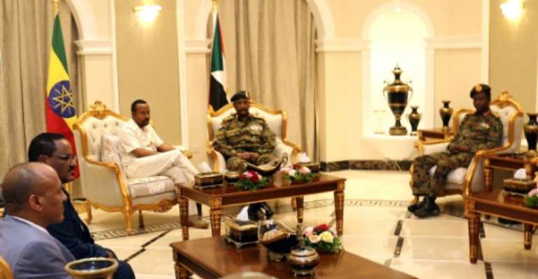 Ethiopia's Prime Minister Abiy Ahmed (C-L) met met separately with Sudan's ruling generals and protest leaders to try and revive talks between the two sides after a bloody crackdown on demonstrators that left dozens dead. By - (AFP)