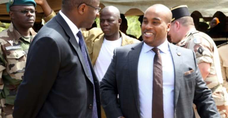 File picture from 2014 of Karim Keita, right, talking to Malian former premier Oumar Tatam Ly. By HABIBOU KOUYATE (AFP)