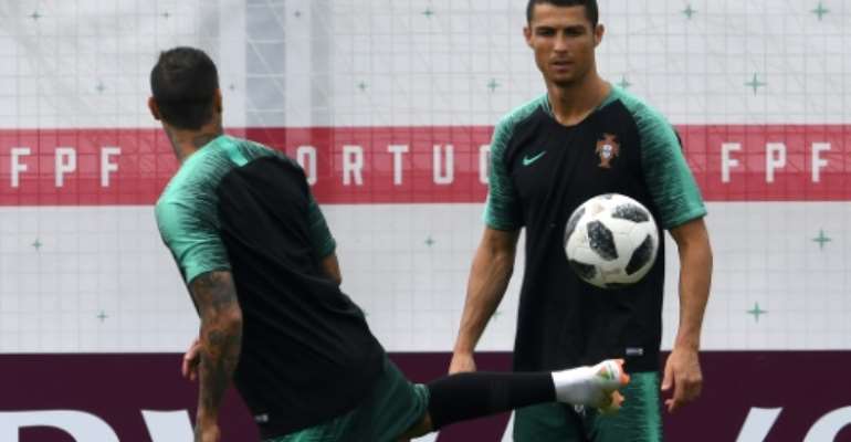Five-time world player of the year Cristiano Ronaldo (R) bagged a sublime treble against Spain in Portugal's opener in Russia 2018's stand-out match so far, the 51st of his glittering career. By Francisco LEONG (AFP)