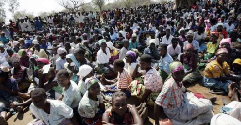 Malawian farmers from Tengani village, in Nsanje district wait to get a ration of maize in 2005. By Gianluigi Guercia (AFP/File)