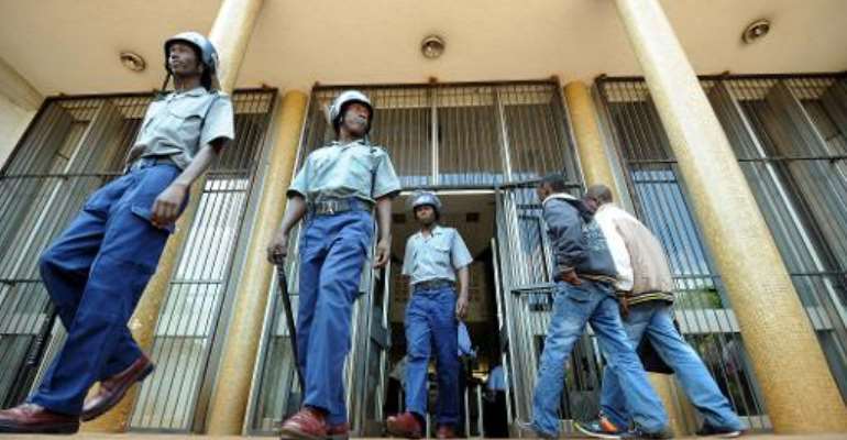 A magistrate's court in Harare sentences two former Air Zimbabwe executives to 10 years in jail each for insurance fraud. By Alexander Joe (AFP)