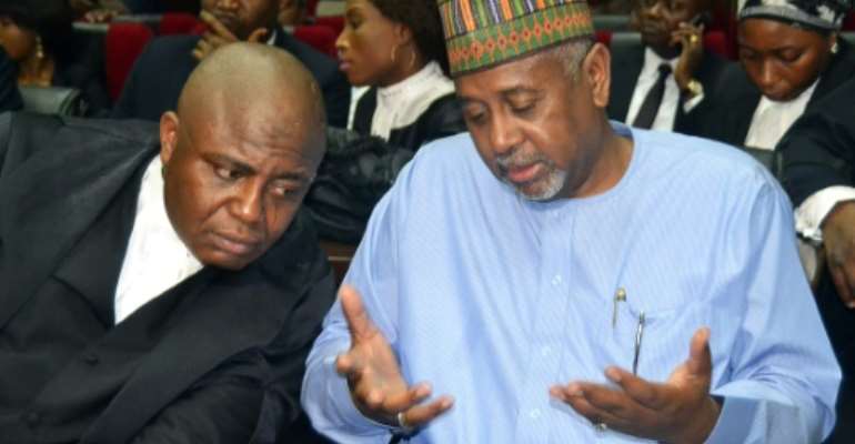 Former national security adviser Sambo Dasuki (R) allegedly oversaw a sprawling embezzlement scheme that saw