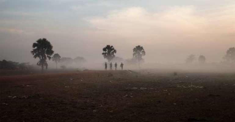 Government soldiers walk along the road that connects the central South Sudanese town of Yirol with the north of the country on February 12, 2014. By Fabio Bucciarelli (AFP/File)