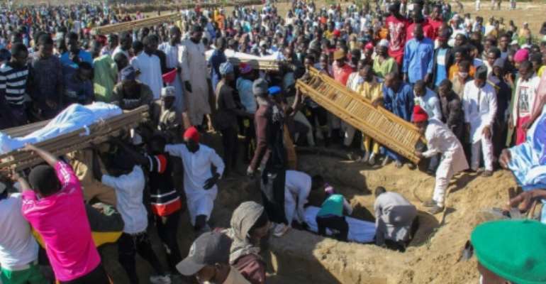 Forty-three farm workers and buried at a mass funeral after the Boko Haram attack in northeastern Nigeria. By Audu Marte (AFP/File)