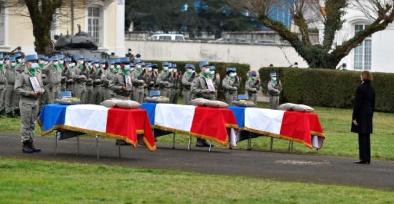 French Defence Minister Florence Parly, right, pays tribute on January 5, 2021, to three soldiers killed in Mali in late December.. By JEAN-CHRISTOPHE VERHAEGEN (AFP)