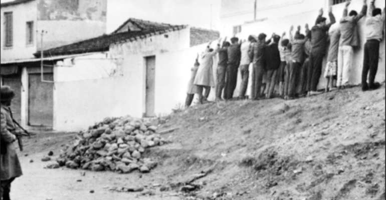 French troops line Algerians up against a wall in Algiers in December, 1960. By STF (AFP/File)