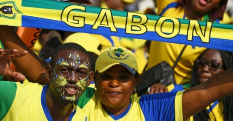 Gabon's exit from the Africa Cup of Nations means a return to economic and social reality. By GABRIEL BOUYS (AFP/File)