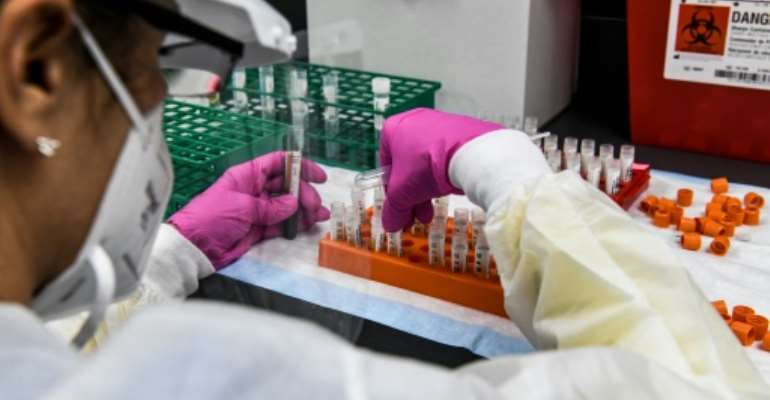 Good news on vaccines has stoked hopes, but experts warn there are still months of hard times ahead. By CHANDAN KHANNA (AFP/File)