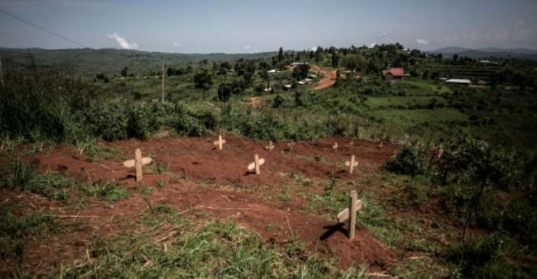 Graves of fallen DR Congo soldiers are pictured in July 2019 outside a base in Djugu, eastern DR Congo. By John WESSELS (AFP/File)