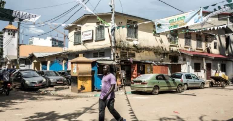 Guinea is preparing for a tense election on Sunday as President Alpha Conde stands for a disputed third term. By JOHN WESSELS (AFP)
