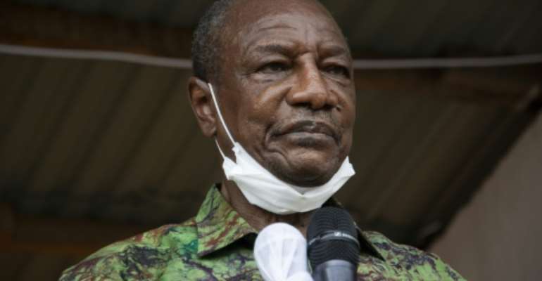 Guinea President Alpha Conde says his third term will be different from the two previous ones. By CAROL VALADE (AFP/File)