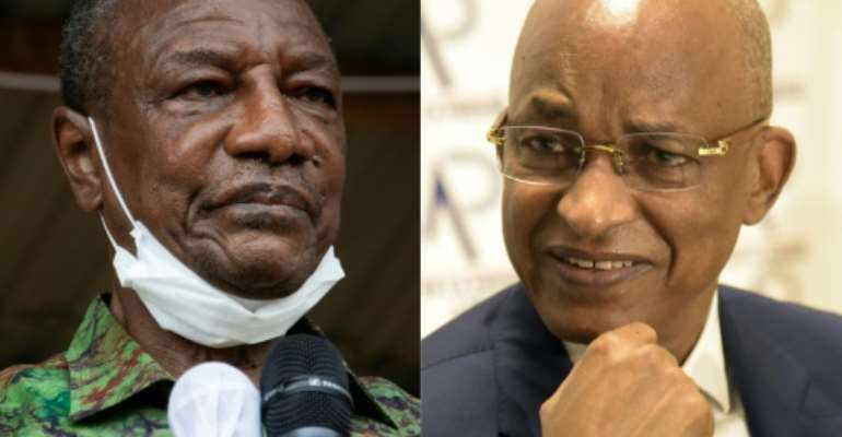 Guinea President Alpha Conde will seek to stave off a challenger from his old political opponent Cellou Dalein Diallo in Sunday's election. By CAROL VALADE, Seyllou (AFP/File)