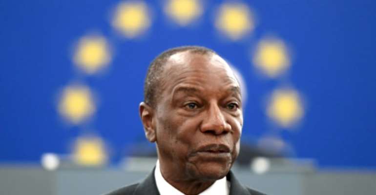 Guinean President Alpha Conde, seen here in May 2018, is facing calls not to amend the constitution to allow himself a new term. By FREDERICK FLORIN (AFP/File)