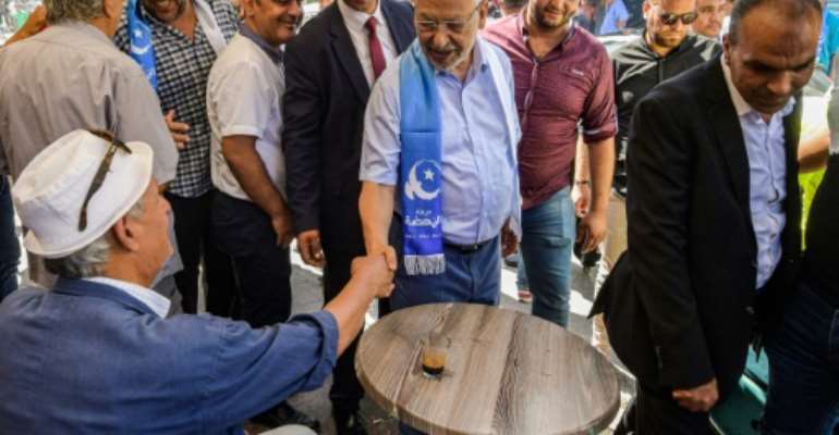 Head of the Ennahdha party Rached Ghannouchi campaigned in the Bab Jdid district of Tunisia's capital Tunis. By FETHI BELAID (AFP)