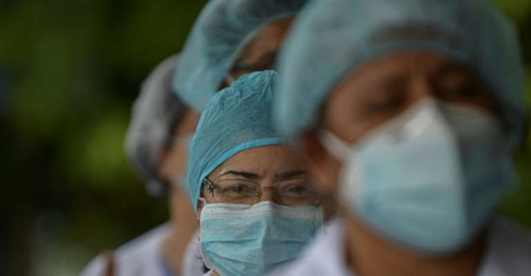 Health workers protest for lack of medical supplies at the Dr Arnulfo Arias Madrid hospital complex in Panama City, on July 16, 2020, as Panama exceeds 50,000 cases of COVID-19. By Luis ACOSTA (AFP)