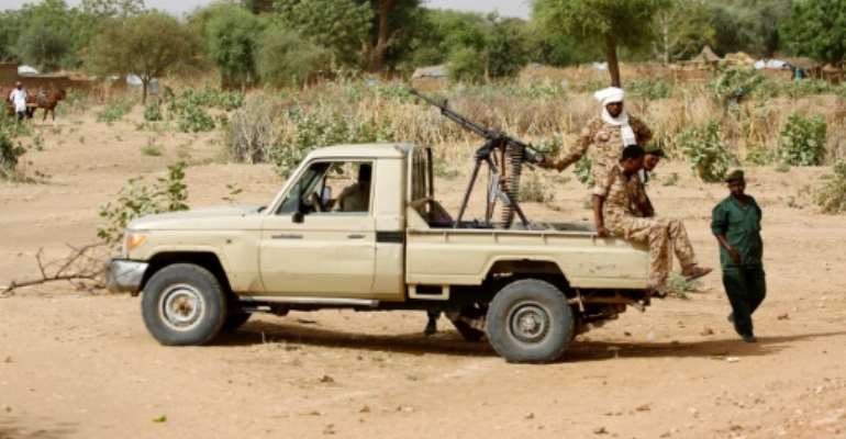 Heavy fighting in Sudan's Darfur has seen over 80 people killed; this photo from April 2016 shows a convoy of Sudanese security forces in El Geneina. By ASHRAF SHAZLY (AFP/File)