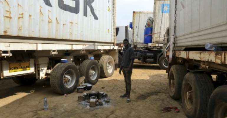 Hundreds of trucks are stuck at the border between Cameroon and the Central African Republic after rebels started to strike the RN1 highway -- the CAR capital's lifeline. By Daniel Beloumou Olomo (AFP)