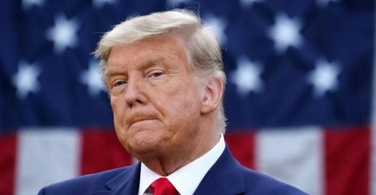 In his first on-camera address in more than a week, the US president touted medical breakthroughs that happened under his watch but said he remained firmly against new lockdowns. By MANDEL NGAN (AFP)