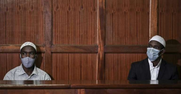 In the dock: Hassan Hussein Mustafa, left, and Mohamed Ahmed Abdi awaiting the verdict on Friday. By TONY KARUMBA (AFP)