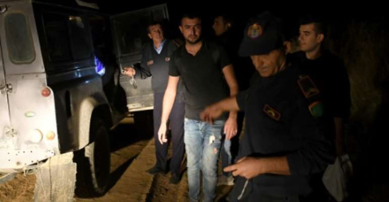 In the last three months, 2,310 migrants were intercepted in Albania --  more than double the 882 migrants caught in all of last year. By GENT SHKULLAKU (AFP)