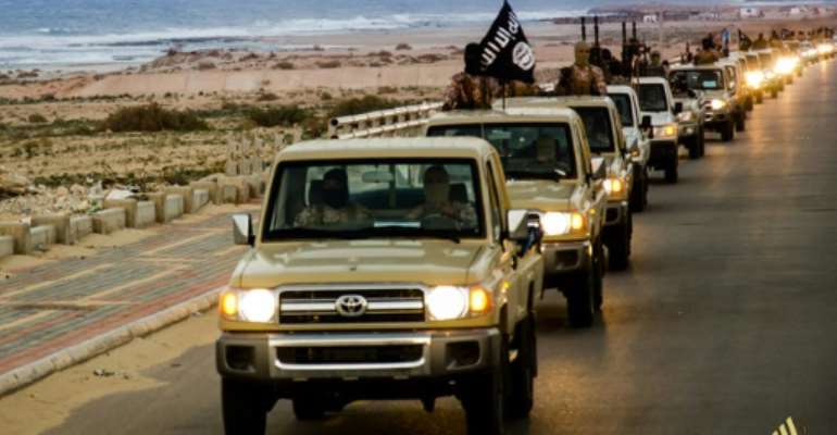 An image from Islamist media outlet Welayat Tarablos on February 18, 2015 allegedly shows members of the Islamic State group parading in a street in Libya's coastal city of Sirte. By (Welayat Tarablos/AFP/File)