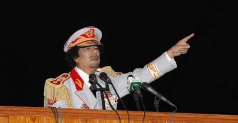 Libyan leader Moamer Kadhafi speaks in 2010. By Mahmud Turkia (AFP/File)