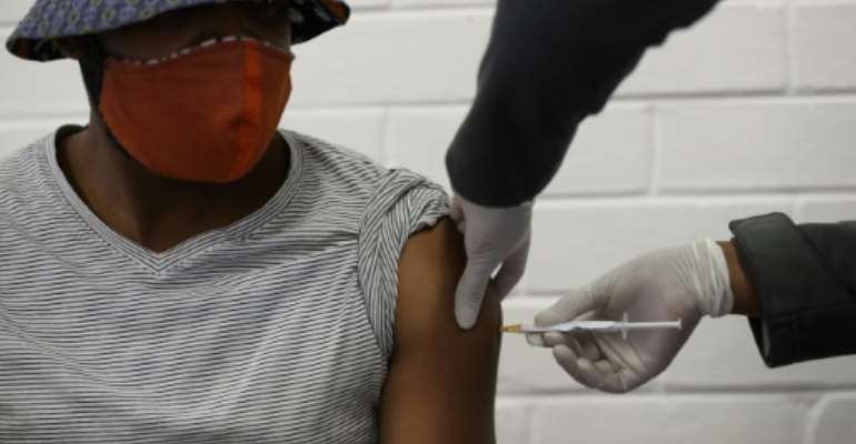 Jab: A volunteer takes part in coronavirus vaccine trial in Soweto, South Africa, in January. By SIPHIWE SIBEKO (POOL/AFP/File)