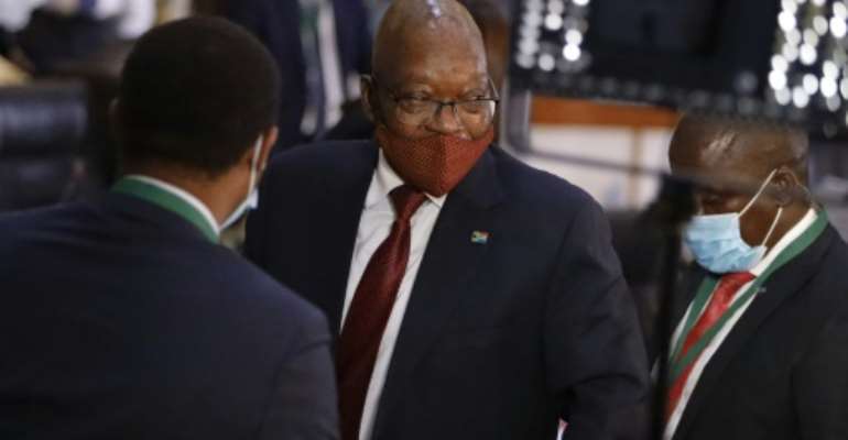 Jacob Zuma, centre, is suspected of having enabled the widespread looting of state assets during his 2009-18 presidency. By Guillem Sartorio (AFP)