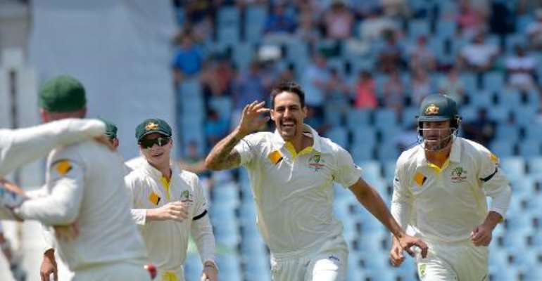 Mitchell Johnson (C) celebrates after bowling out South Africa's Graeme Smith in the first test match between South Africa and Australia at SuperSport Park in Centurion on February 13, 2014. By Alexander Joe (AFP)