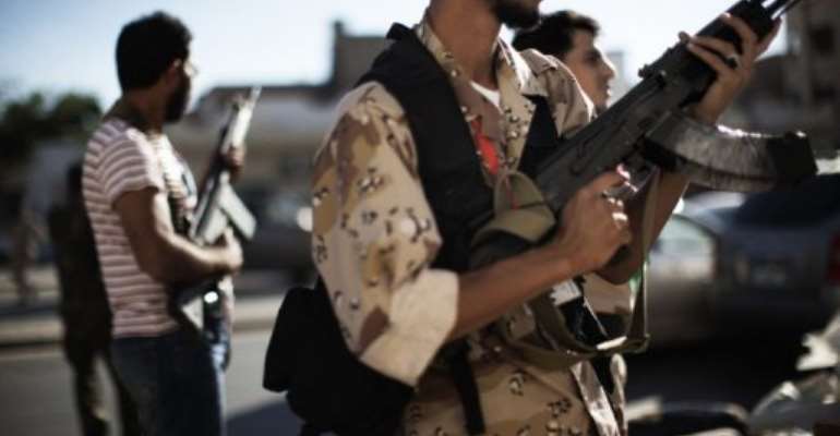 Libyan National Transitional Council fighters deploy in Tripoli. By Marco Longari (AFP/File)