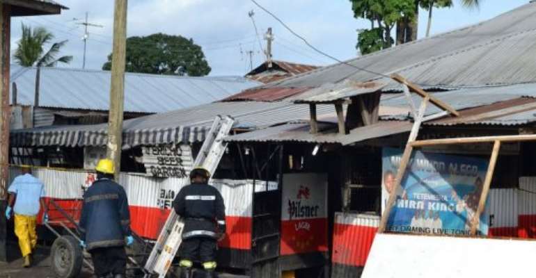 Mombasa's firemen inspect the scene of a grenade attack. By (AFP)