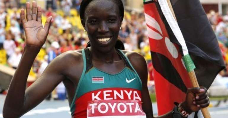 Edna Kiplagat celebrates after winning the women's marathon at the World Athletics Championships in Moscow. By Adrian Dennis (AFP)