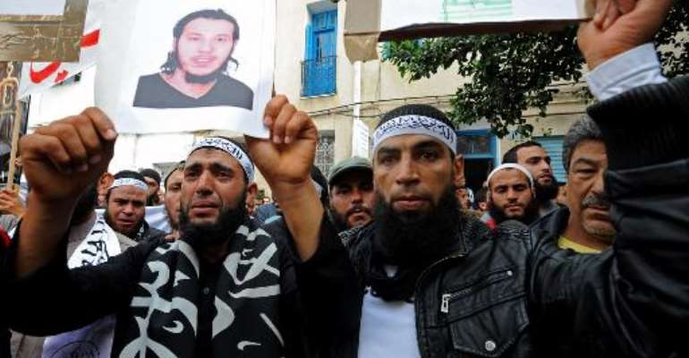 Tunisian Salafists rally in front of a court house in Tunis on November 6, 2012, to demand the release of people arrested in connection with the attack on the US embassy. By Fethi Belaid (AFP/File)