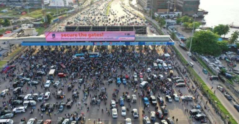 Lekki Toll Gate had become a place of protest, partying and prayers as thousands of mainly young people blocked one of the main highways in Lagos. By Pierre FAVENNEC (AFP/File)
