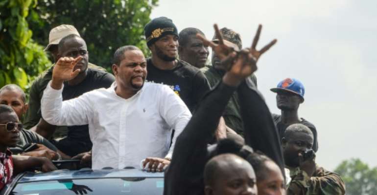 Liberian radio show host and opposition leader Henry Costa (2nd L) is one of those behind the anti-government protests. By Zoom DOSSO (AFP)